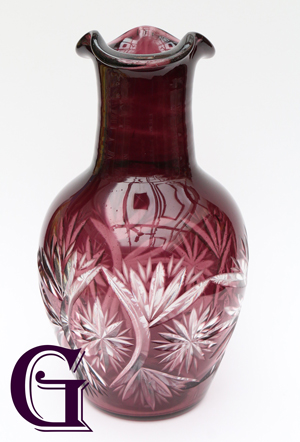 An amethyst cut glass vase