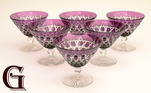 A set of six all amethyst champagne glasses with cut facet bowls