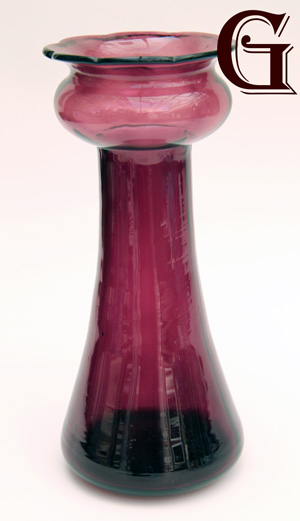 An amethyst glass hyacinth vase