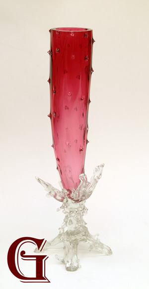 A cranberry rustic vase