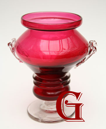 A cranberry glass vase