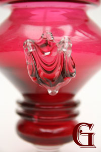 A cranberry glass vase