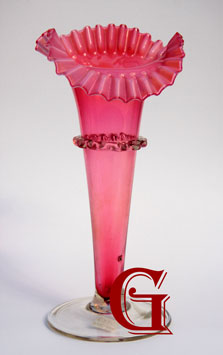 A tall opalescent ruffle top Jack in the Pulpit cranberry vase