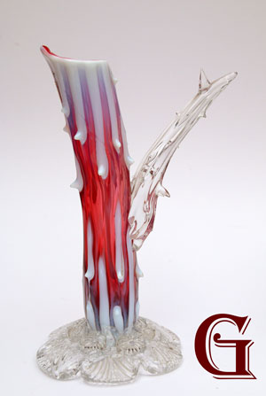 A cranberry opalescent rustic vase 